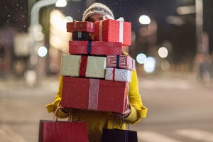 Woman-Carrying-Stack-Of-Gifts-11-17